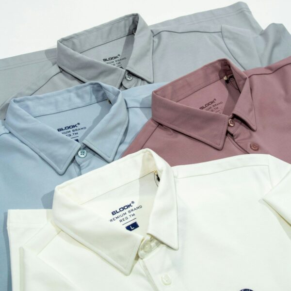 a group of four men's shirts sitting next to each other